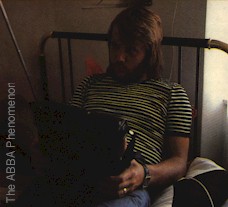 Benny listening to a radio